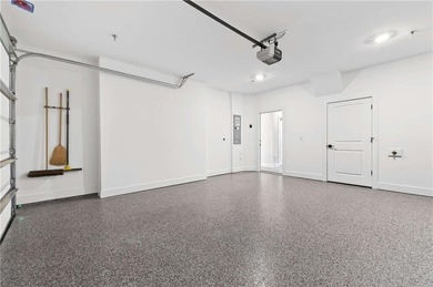 Just one year old and like new, this luxury townhome is located