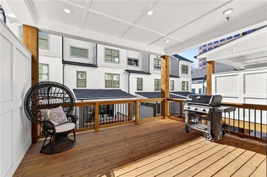 Just one year old and like new, this luxury townhome is located