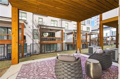 Just one year old and like new, this luxury townhome is located