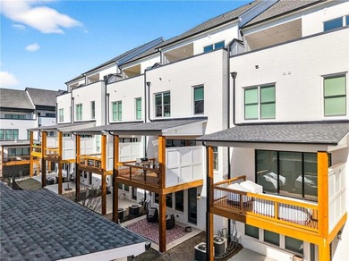 Just one year old and like new, this luxury townhome is located