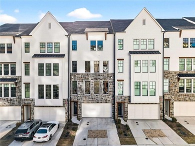 Just one year old and like new, this luxury townhome is located