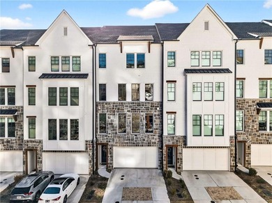 Just one year old and like new, this luxury townhome is located