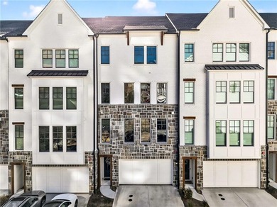 Just one year old and like new, this luxury townhome is located