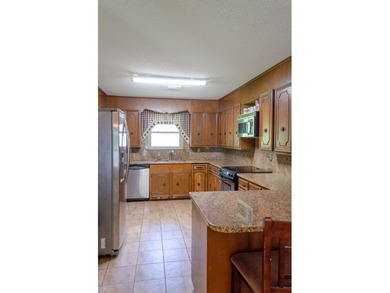 Welcome to this charming ranch-style brick home nestled on a - photo 27