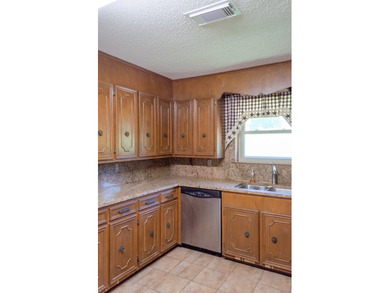 Welcome to this charming ranch-style brick home nestled on a - photo 28