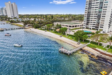 Experience coastal luxury in this gated condo at Palm Beach - photo 1