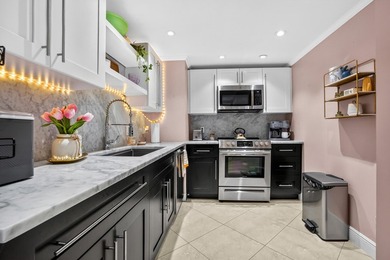 Experience coastal luxury in this gated condo at Palm Beach - photo 10