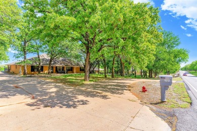 Nestled on a scenic half-acre riverfront lot in Pecan Plantation - photo 1