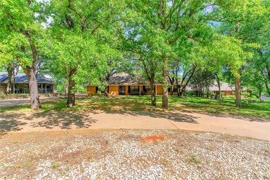 Nestled on a scenic half-acre riverfront lot in Pecan Plantation - photo 3