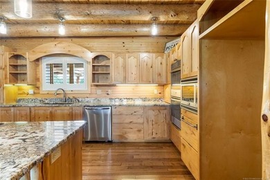 This meticulous, custom log home is high quality in design - photo 15