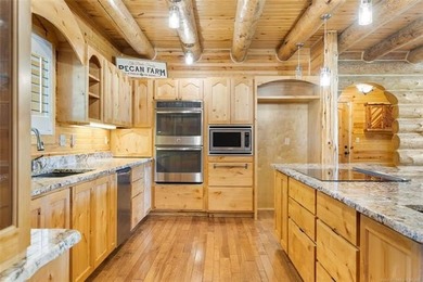 This meticulous, custom log home is high quality in design - photo 17