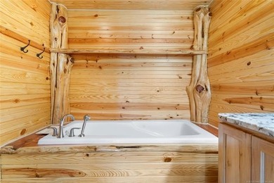 This meticulous, custom log home is high quality in design - photo 21