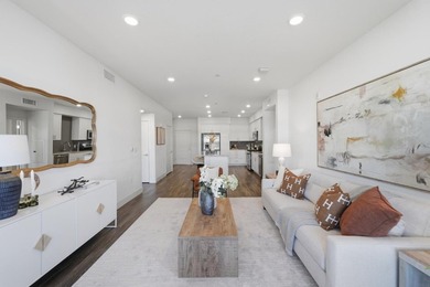 Welcome to 5933 Sunstone Dr #410, a modern luxury condo with 2