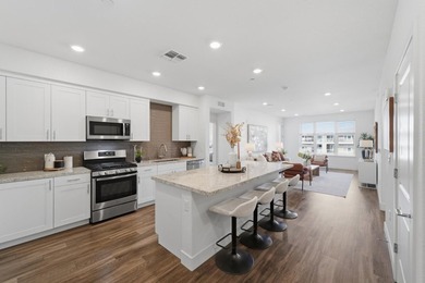 Welcome to 5933 Sunstone Dr #410, a modern luxury condo with 2