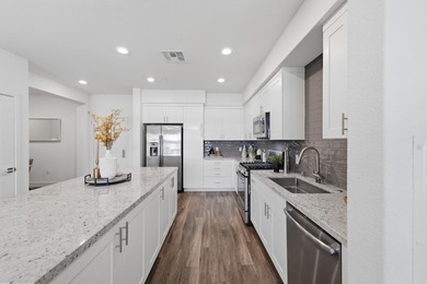 Welcome to 5933 Sunstone Dr #410, a modern luxury condo with 2