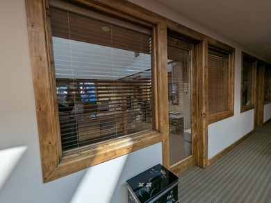 Elegant wood-paneled common area atrium, shared conference room - photo 6