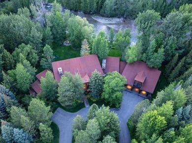 Set on 2.5 acres directly on the Bigwood River within a private - photo 1
