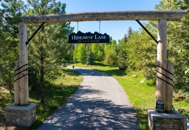 Set on 2.5 acres directly on the Bigwood River within a private - photo 2