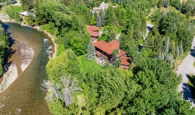 Set on 2.5 acres directly on the Bigwood River within a private - photo 3