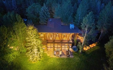 Set on 2.5 acres directly on the Bigwood River within a private - photo 4