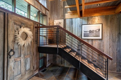 Set on 2.5 acres directly on the Bigwood River within a private - photo 7