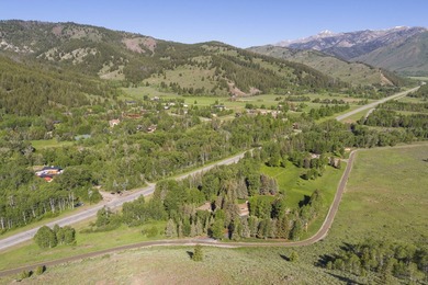 Set on 6.7 pristine acres along the Big Wood River and bordering - photo 3
