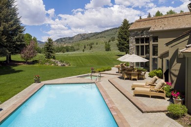 Set on 6.7 pristine acres along the Big Wood River and bordering - photo 4