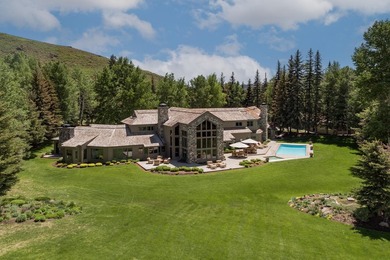 Set on 6.7 pristine acres along the Big Wood River and bordering - photo 9