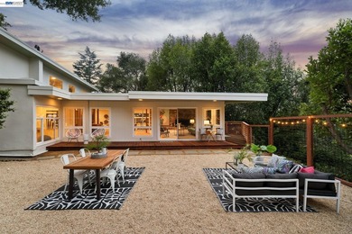 Hidden behind mature trees on a rare, level +/- half acre lot in - photo 4