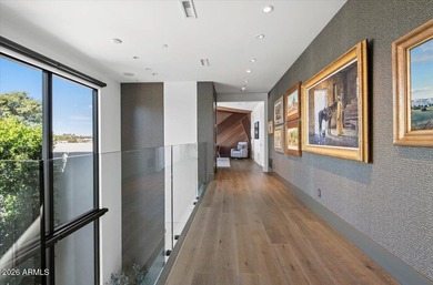 Located within a guard-gated enclave, this Paradise Valley