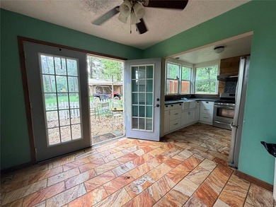 Tucked away on 7.6+ acres of unrestricted, lakefront land on - photo 11