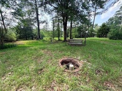 Tucked away on 7.6+ acres of unrestricted, lakefront land on - photo 13