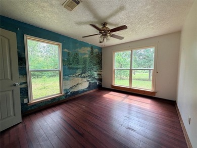 Tucked away on 7.6+ acres of unrestricted, lakefront land on - photo 16