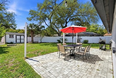 A bright, open living space, a backyard built for hosting, and a - photo 22