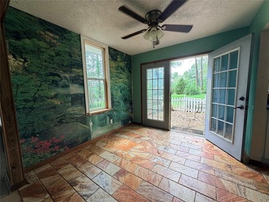 Tucked away on 7.6+ acres of unrestricted, lakefront land on - photo 24