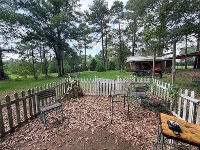 Tucked away on 7.6+ acres of unrestricted, lakefront land on - photo 25