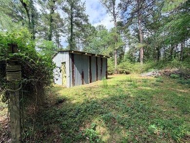 Tucked away on 7.6+ acres of unrestricted, lakefront land on - photo 33