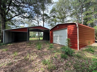 Tucked away on 7.6+ acres of unrestricted, lakefront land on - photo 34