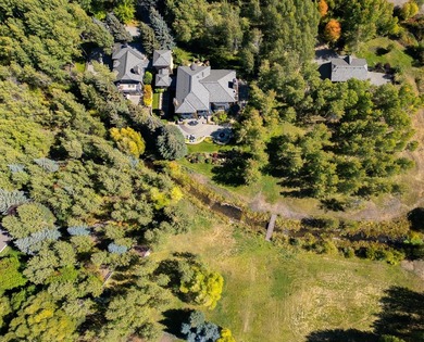 Set on over 5 acres of lushly landscaped grounds, the riverside - photo 3