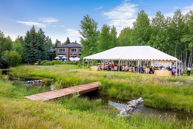 Set on over 5 acres of lushly landscaped grounds, the riverside - photo 4