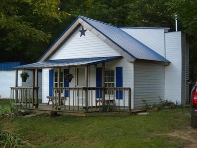 20' x 20' cabin with a half loft on property . It is wired for a - Lake Acreage Active Under Contract in Summer Shade, Kentucky