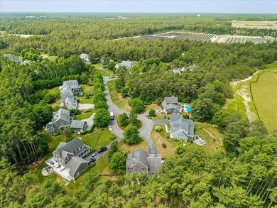 Overlooking Tihonet Pond, 22 Red Pine Lane offers a distinctive - photo 13