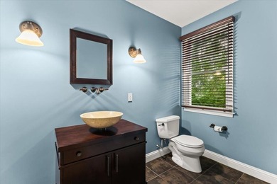 Overlooking Tihonet Pond, 22 Red Pine Lane offers a distinctive - photo 17