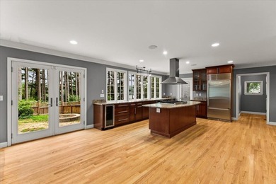 Overlooking Tihonet Pond, 22 Red Pine Lane offers a distinctive - photo 20