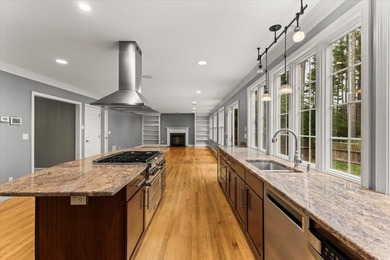 Overlooking Tihonet Pond, 22 Red Pine Lane offers a distinctive - photo 26