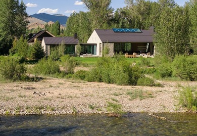 River Lodge, a new riverfront estate set on 2.1 acres along the - photo 2