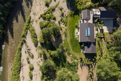 River Lodge, a new riverfront estate set on 2.1 acres along the - photo 5