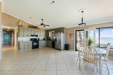 This amazing bay front home gives the feeling of being out in - photo 13