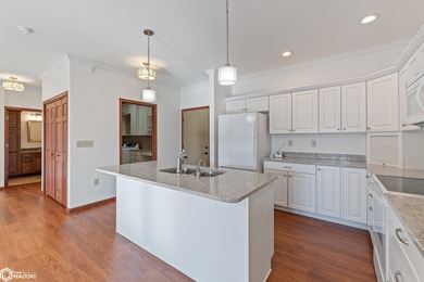 Welcome to this beautifully appointed main-level condo in Garden