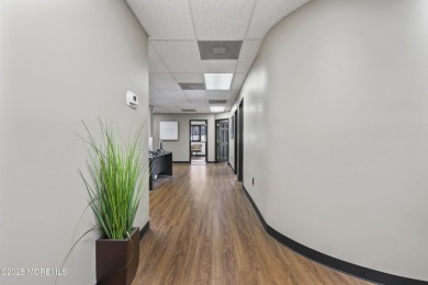 Beautifully updated second-floor, corner commercial condo in one